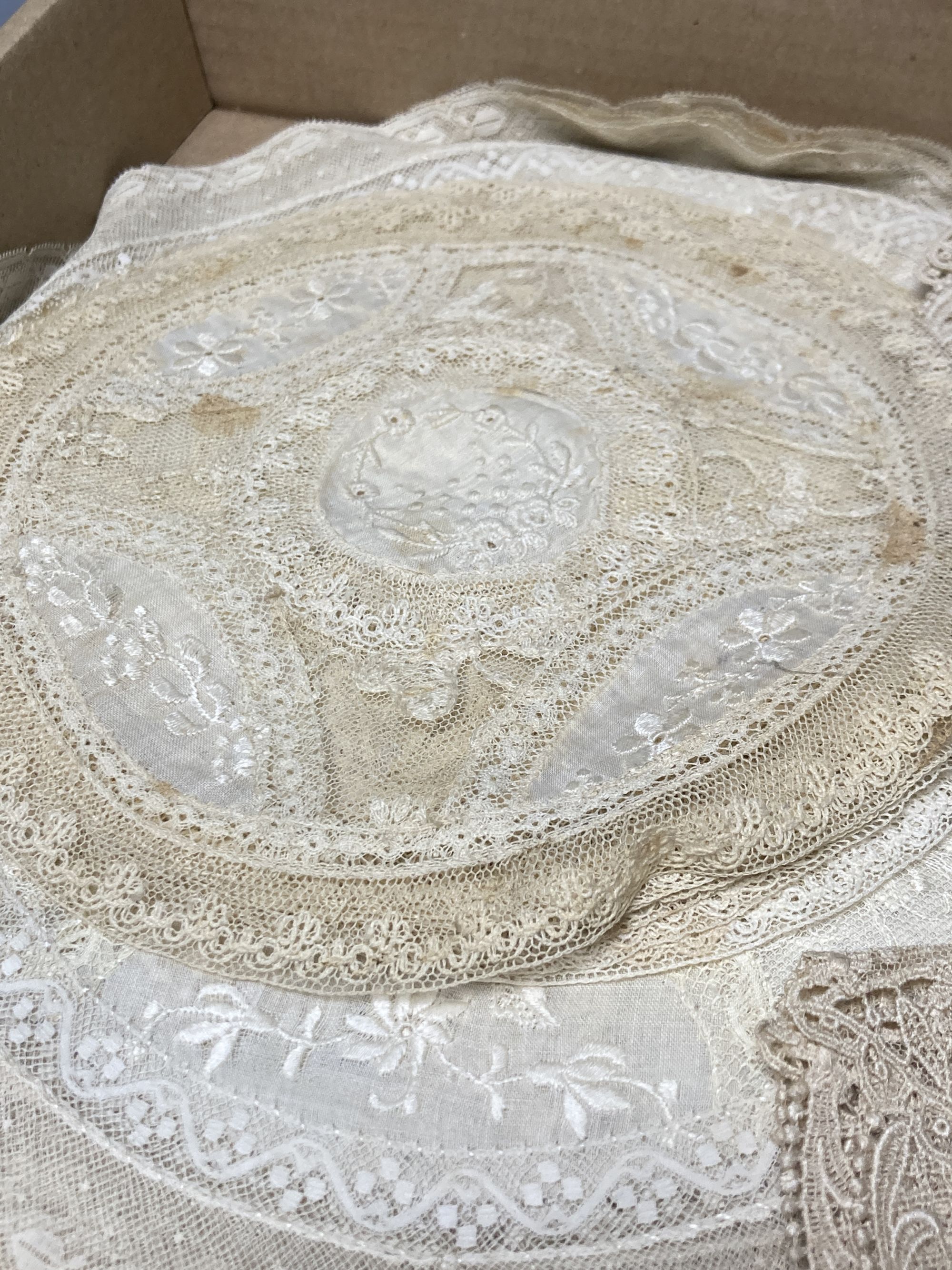 A set of Normandy lace table mats and assorted mats